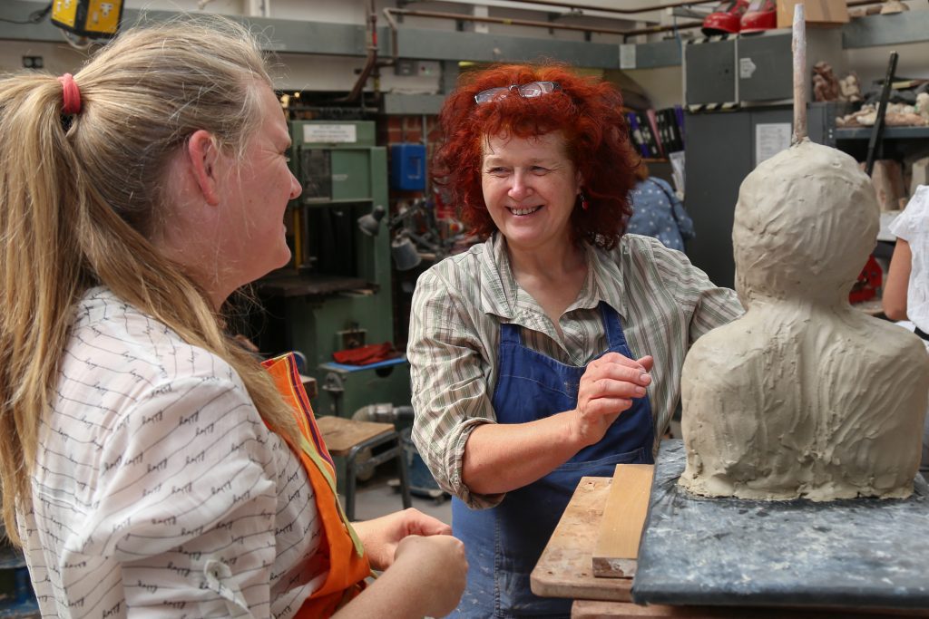 Students working in a ceramics class