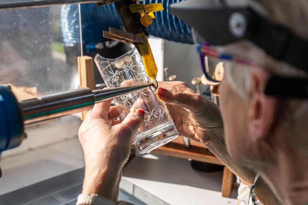 Student working with glass