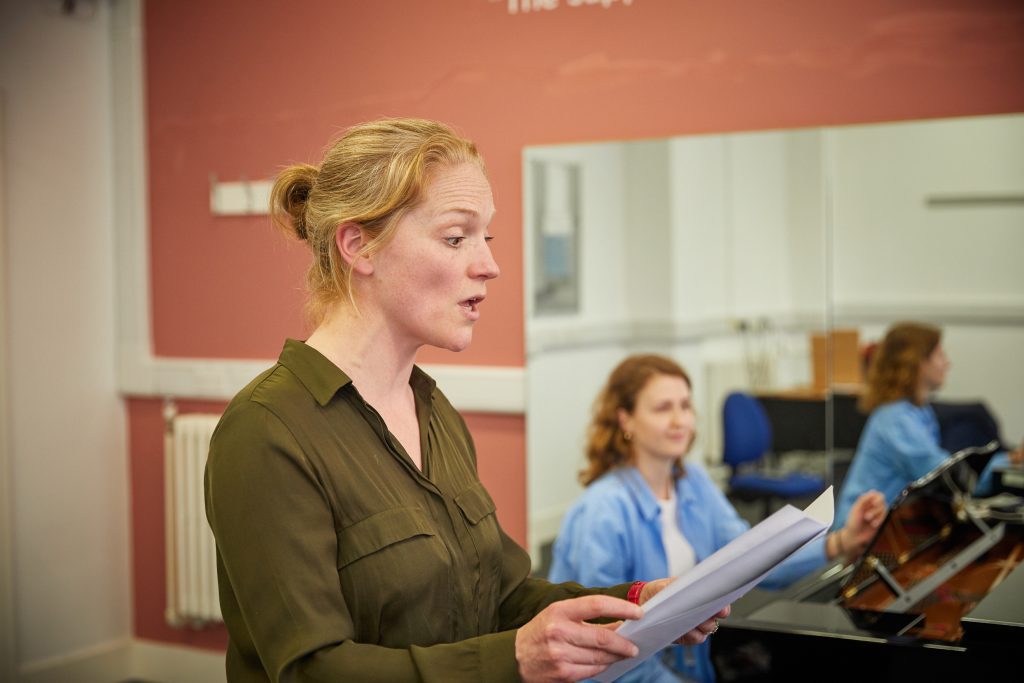 Woman singing in a class