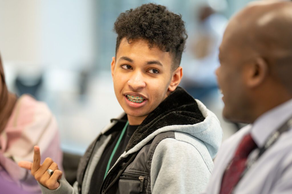 Male student talking to tutor