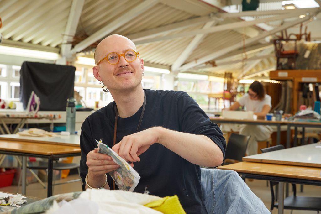 Man in textiles studio