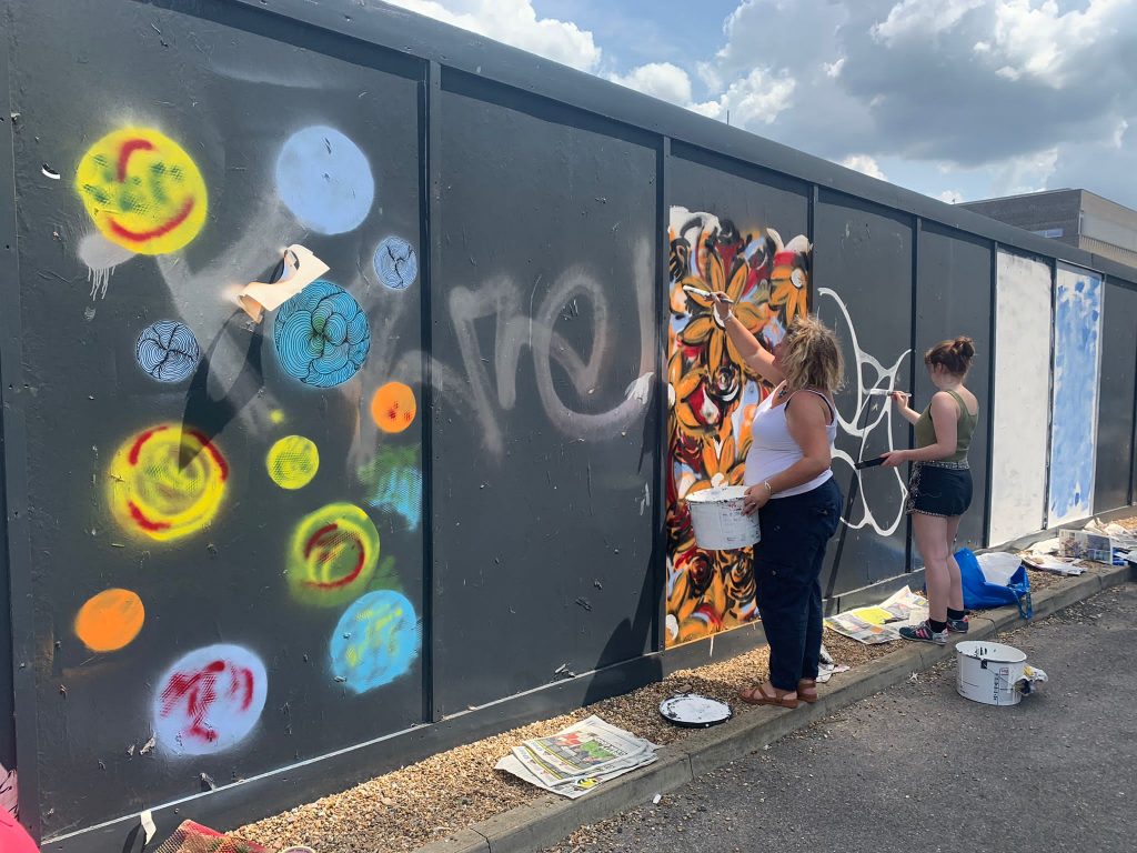 Art Students painting mural 