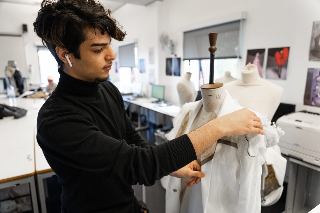 Young man in fashion studio