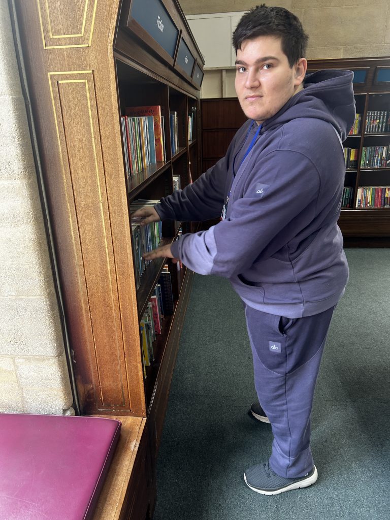student in library